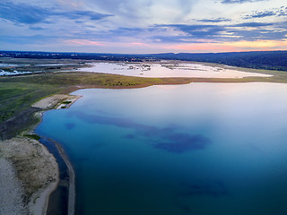 Image showing Sunset views over the rural landscape and lake