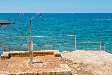 Image showing Shower on the rocky beach in Istria