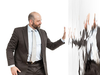 Image showing business man at a wall of water