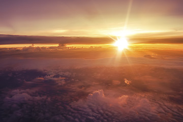 Image showing sunset over the clouds