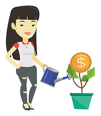 Image showing Business woman watering money flower.