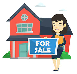 Image showing Young female realtor offering house.