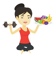 Image showing Healthy woman with fruits and dumbbell.