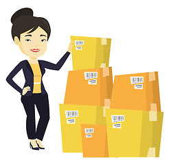 Image showing Business woman checking boxes in warehouse.