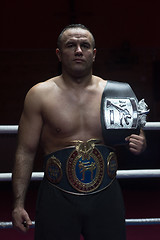 Image showing kick boxer with his championship belt