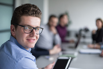 Image showing Businessman using tablet in modern office