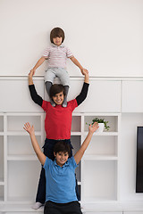 Image showing young boys posing line up piggyback