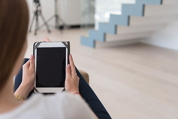 Image showing woman sitting on sofa with tablet computer