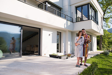 Image showing Young beautiful couple in bathrobes