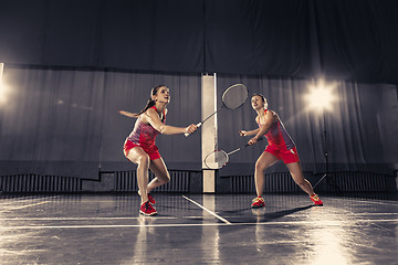 Image showing Young women playing badminton at gym