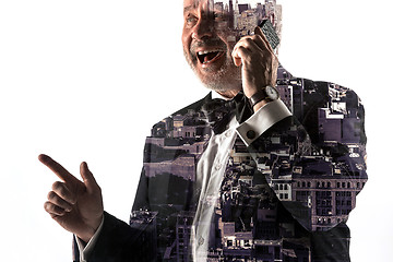 Image showing Portrait of bearded businessman smiling. Double exposure city on the background.