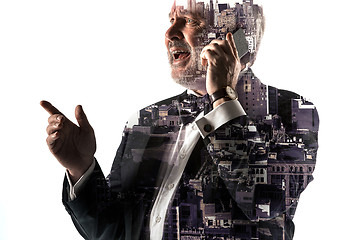 Image showing Portrait of bearded businessman smiling. Double exposure city on the background.