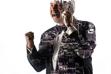 Image showing Portrait of bearded businessman smiling. Double exposure city on the background.