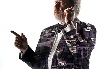 Image showing Portrait of bearded businessman with phone. Double exposure city on the background.