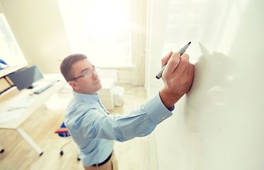 Image showing teacher writing on school white board