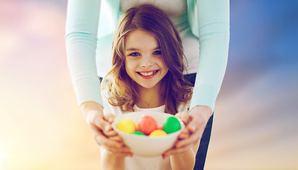 Image showing close up of girl and mother holding easter eggs