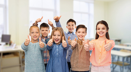 Image showing happy students showing thumbs up at school