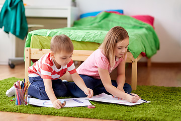 Image showing happy kids drawing at home