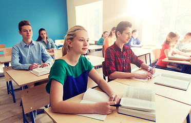 Image showing group of students with books at school lesson