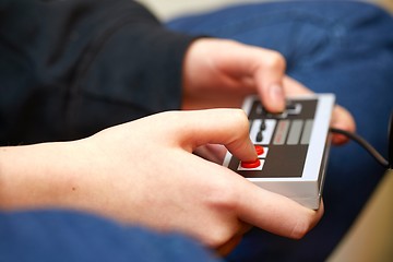 Image showing Playing an old gaming console