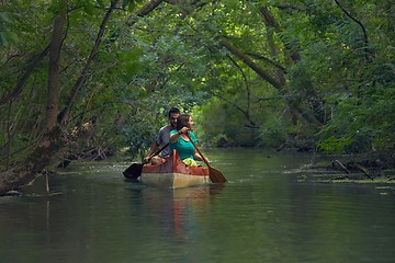 Image showing Canoe tour on a river