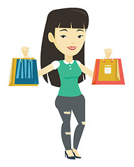 Image showing Happy woman holding shopping bags.