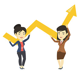 Image showing Two business women holding growth graph.