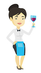 Image showing Bartender holding a glass of wine in hand.