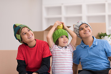 Image showing boys with cardboard boxes around them