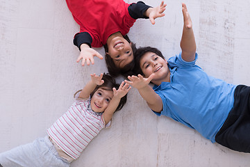 Image showing young boys having fun on the floor