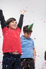 Image showing kids  blowing confetti