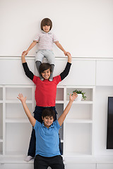 Image showing young boys posing line up piggyback