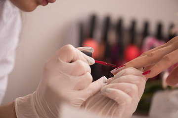 Image showing Woman hands receiving a manicure