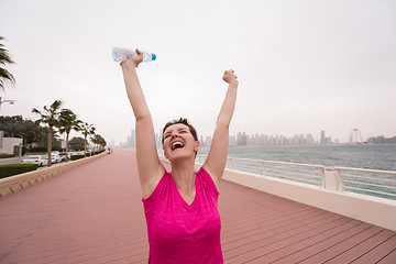 Image showing young woman celebrating a successful training run