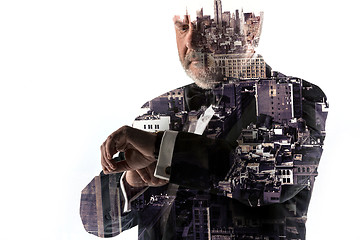 Image showing Portrait of bearded businessman. Double exposure city on the background.