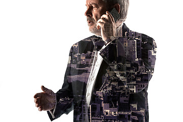 Image showing Portrait of bearded businessman with phone. Double exposure city on the background.