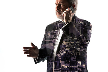 Image showing Portrait of bearded businessman with phone. Double exposure city on the background.