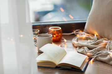 Image showing book and coffee or hot chocolate on window sill