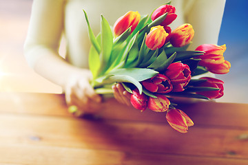 Image showing close up of woman holding tulip flowers