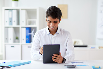 Image showing businessman working with tablet pc at office