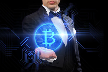 Image showing close up of magician with bitcoin symbol