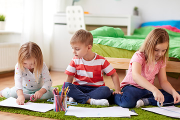 Image showing happy kids drawing at home