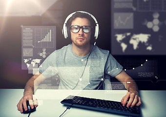 Image showing man in headset with computer over virtual screens