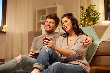 Image showing happy couple drinking coffee and eating at home