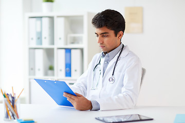 Image showing doctor with clipboard at clinic