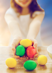 Image showing close up of girl holding colored easter eggs