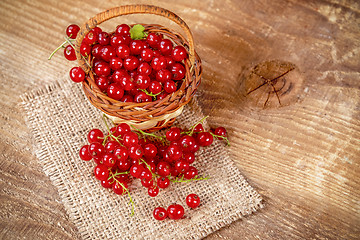 Image showing Redcurrant on wooden table