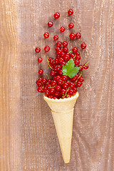 Image showing Red currant fruits in an ice cream cone 