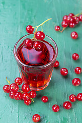 Image showing Redcurrant and glass of fruit drink juice