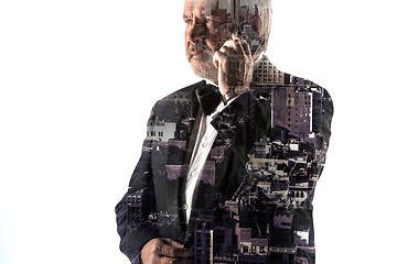 Image showing Portrait of bearded businessman smiling. Double exposure city on the background.
